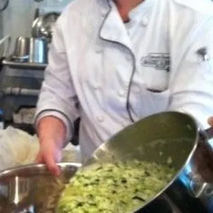 Mixing our famous Zucchini Cake with zucchini from our garden.
