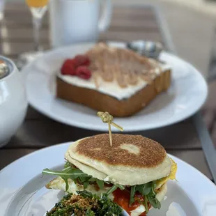 Fancy breakfast sandwich and brioche French toast