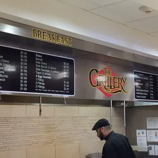 Breakfast and lunch menus above meal preparation area.