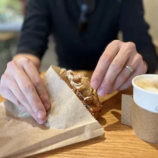 a person eating a pastry