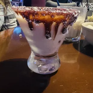 Kim Rocks! Chocolate with hand-crushed candy cane dipped glass filled with a shaken peppermint martini     Pic doesn&apos;t do justice.