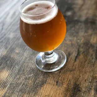 a glass of beer on a table
