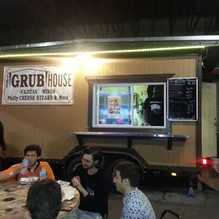 a group of people sitting around a table