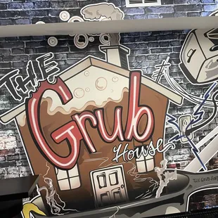 a brick wall with graffiti