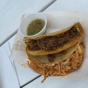 Potato tacos. One with beef, one with chicken.