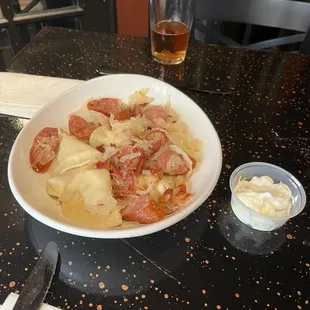 The Polish bowl...kielbasa, pierogis, sauerkraut, bacon and sour cream