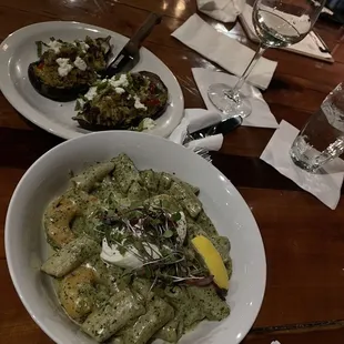 Creamy pesto pasta with shrimp and lamb stuffed eggplant.