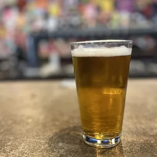 a pint of beer on a table