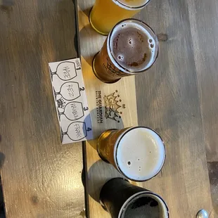 a flight of beers on a table