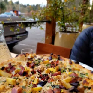 Good beer, great service and location.   Clam pizza in photo.