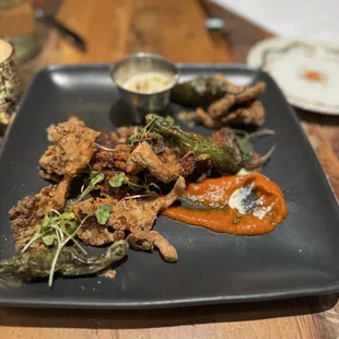 Osyter mushrooms, tempura style, shishito peppers, tomato fondue, truffle aioli