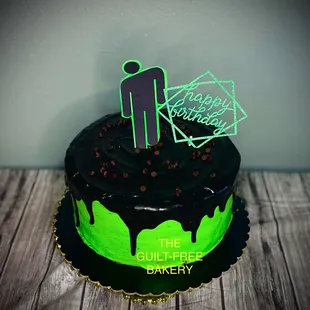 a chocolate cake with green icing