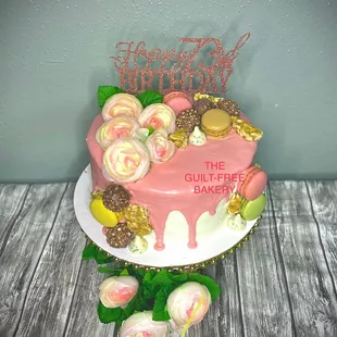 a cake decorated with pink icing