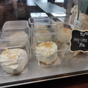 a variety of desserts in plastic containers