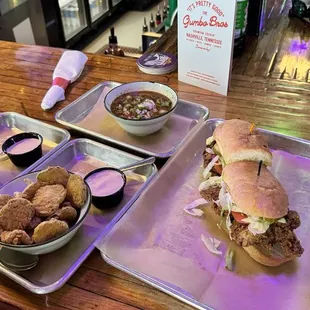 Chicken po-boy, fried okra, pickles and gumbo.