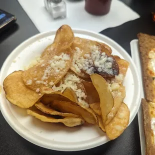a plate of chips and pizza