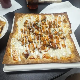 a square pizza on a table
