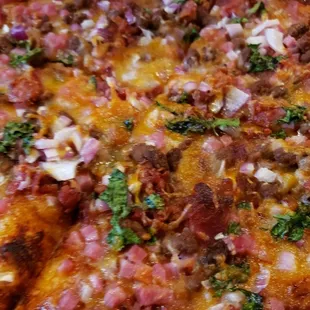 The Texan Pizza - Beef, Bacon, Ham, Red Onion, Cilantro, BBQ Sauce, Cheddar Mixed Cheese