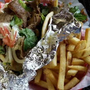 1/2 gyro combo. Salad and sauce comes on top, served with fries and a drink.