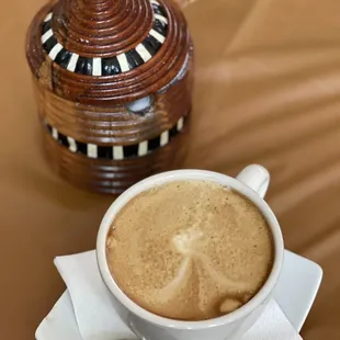 a cup of coffee and a spoon