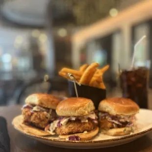a plate of burgers and fries