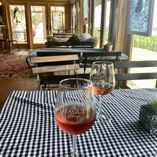 two glasses of wine on a table