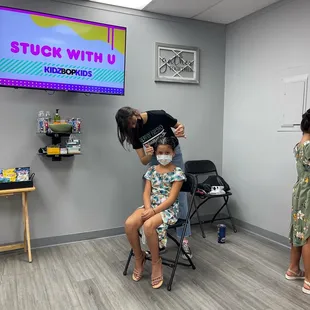 Getting her hair and nails done