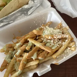 Loaded fries- hold the olives. Tipped over but it's delish!