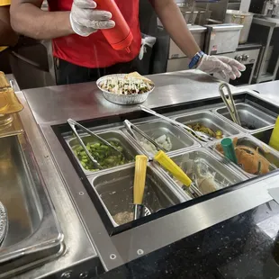 Employee making a platter.