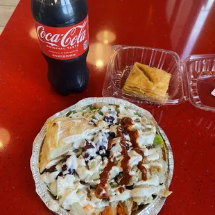 Baklava for dessert, Chicken Platter with red sauce , white sauce and spicy sauce.