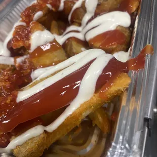 a hot dog with ketchup and ketchup