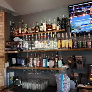 a bar with a variety of liquors