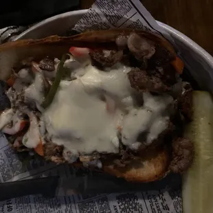 Philly cheesesteak on a pretzel bun