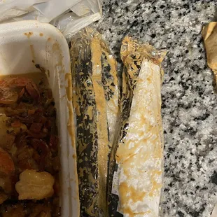 a half eaten sandwich and a half eaten sandwich