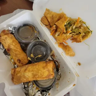 a takeout container with food in it