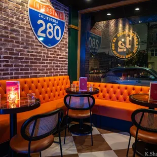 Front corner seating on the right side of the main entrance door.