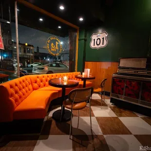 Front corner seating area to the left of the main door.