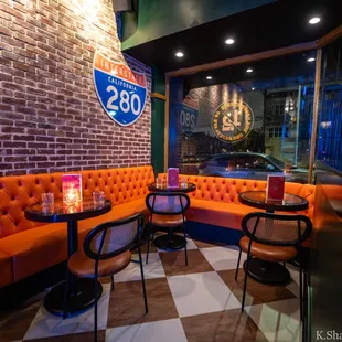 Front corner seating on the right side of the main entrance door.