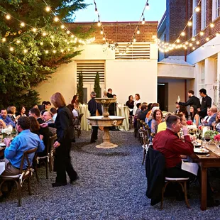 The Garden Courtyard, an oasis of greenery, string lights and even a carved stone fountain.