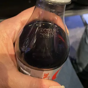 Expired, flat, disgusting soda.
