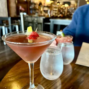 a close up of a cocktail in a martini glass