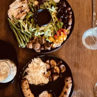 Brat platter, grilled chicken Niçoise salad, peek of ricotta honey app.