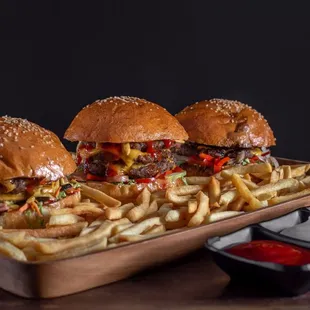 three burgers and fries