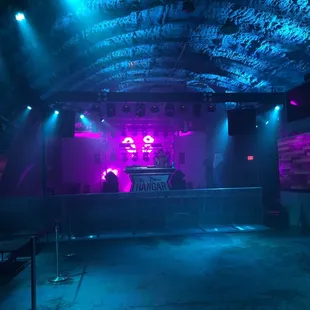 a stage with purple and blue lights