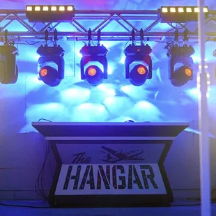 a stage with lights and a sign