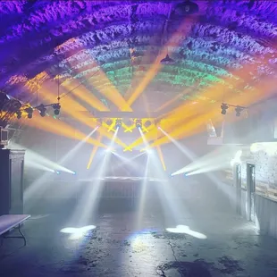 a stage with bright beams of light