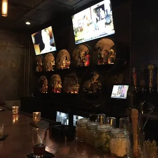 The bar backdrop made of barrels, nice!