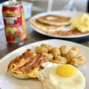 English muffin sunny side up w bacon  Side of potato tots