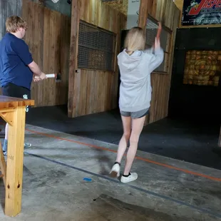 two people playing a game of ping pong