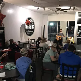 a group of people sitting at tables